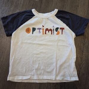 3 for $15 / Open Edit • "Optimist" Graphic Baseball Tee